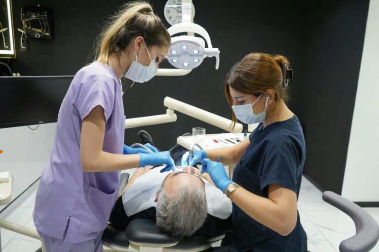 Dentists working on a patient in a modern Istanbul clinic, showcasing professional dental care.